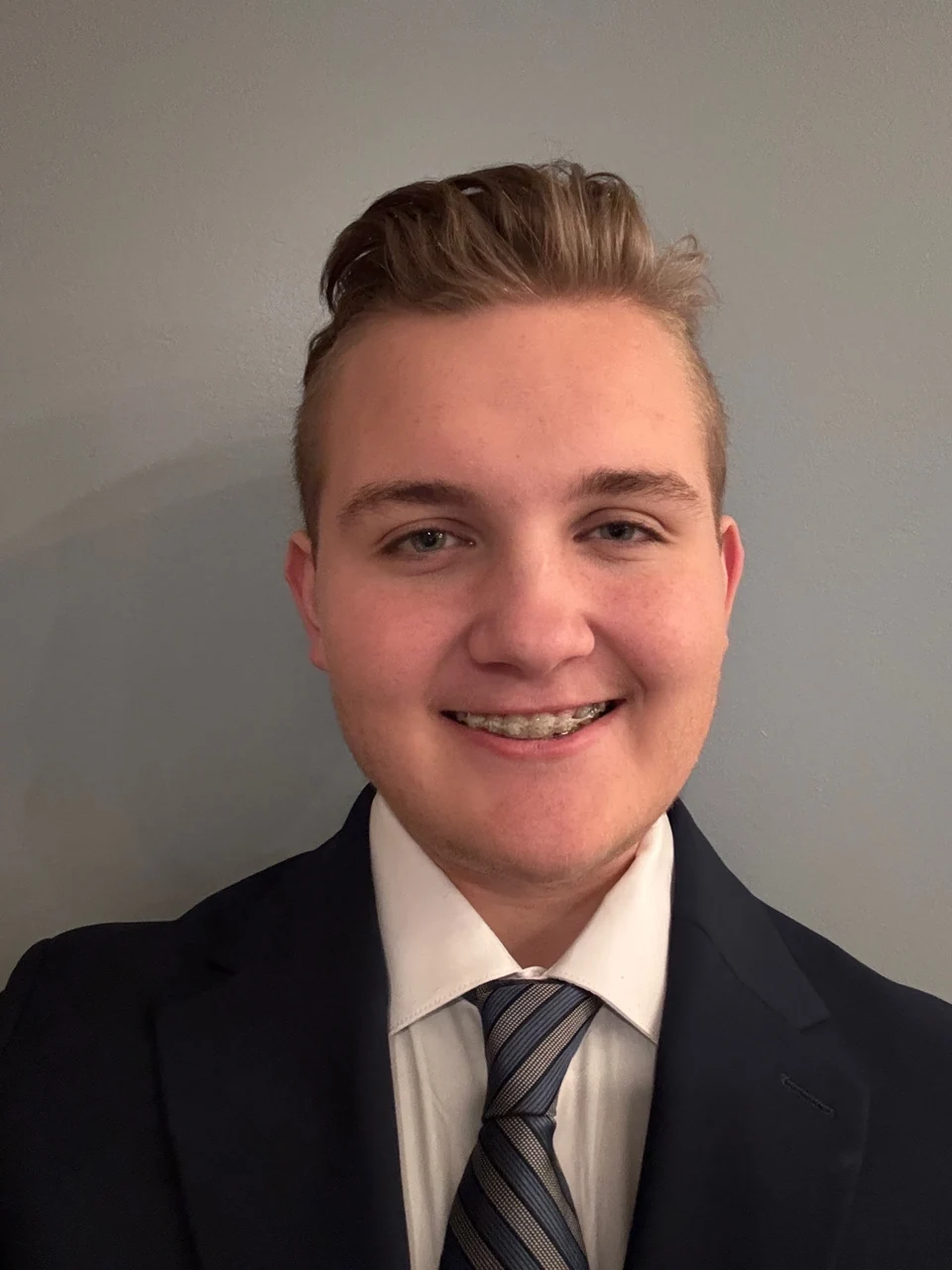 Donovan Baney in a suit and tie